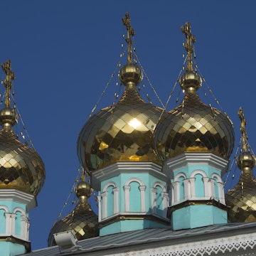 Gold onion domes on turquoise St. Nicholas church (Nikolsky Sobor) on Baytursynuly street.