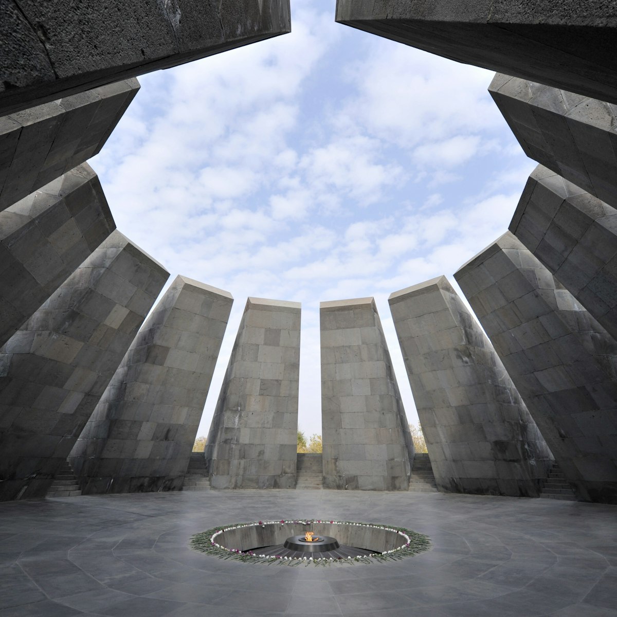 "Yerevan, Armenia - October 28, 2009. Eternal flame in Tsitsernakaberd. Tsitsernakaberd is a memorial dedicated to the victims of the Armenian Genocide in 1915. Yerevan, Armenia. The eternal flame inside the memorial."