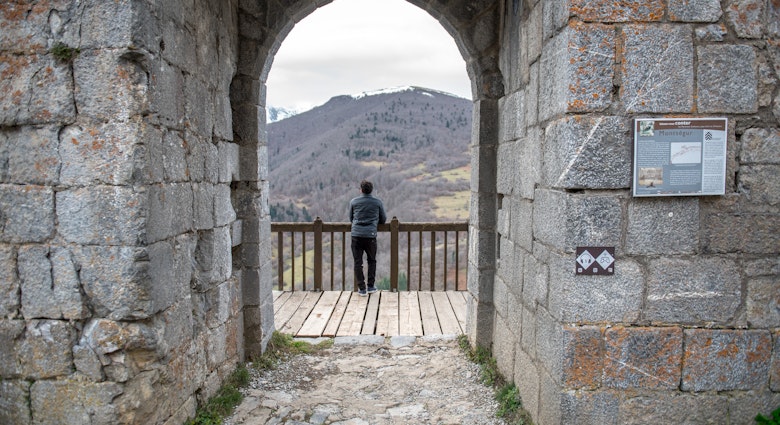 Montsegur, Aringe, France: 2020 from December 20: Men in Cathar castle of Montsegur in Ariege, Occitanie in south of France in winter 2020