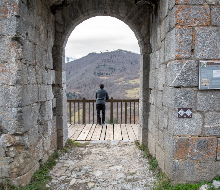 Montsegur, Aringe, France: 2020 from December 20: Men in Cathar castle of Montsegur in Ariege, Occitanie in south of France in winter 2020