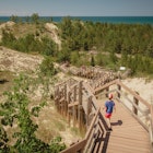 Boy hiking along dune succession trail in Indiana Dunes National Park.
1325469383
Boy hiking along dune succession trail in Indiana Dunes National Park