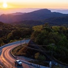 Way on the Mountain with sunrise time
1379113010
A car on a curvy mountain road at sunrise
