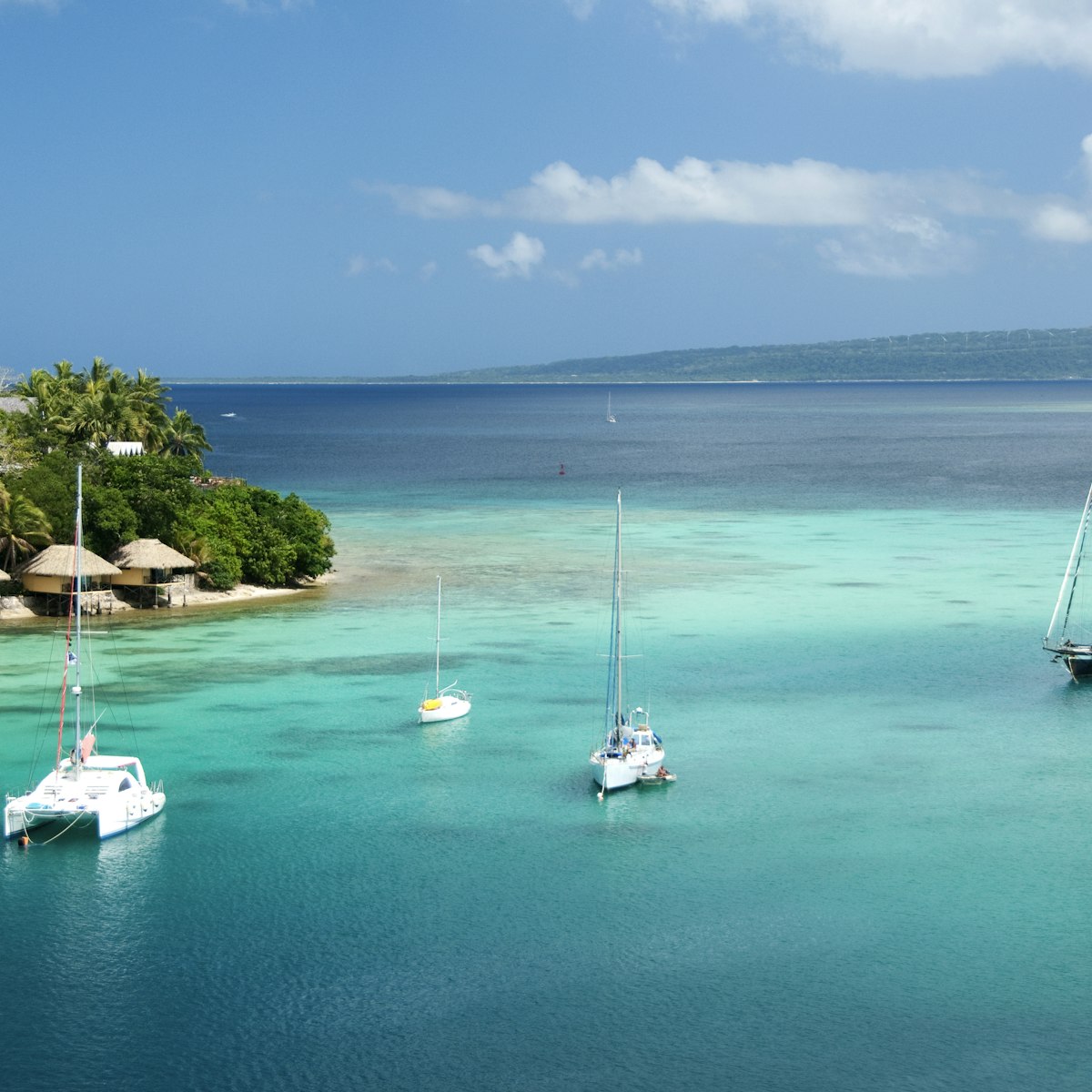 Bungalows on Iririki Island and yachts on Mele Bay from Port Vila.