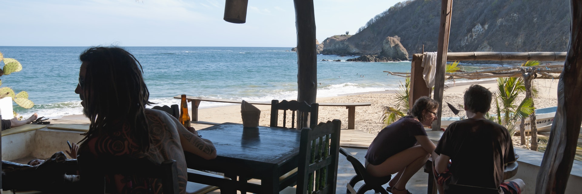 Travelers relaxing at the restaurant at Posada del Arquitecto.