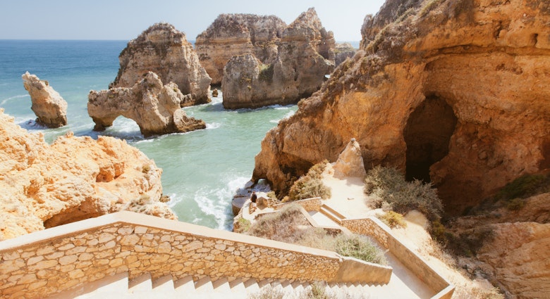 Rocky cliff seascape with steps to beach in Lagos, Algarve, Portugal. Ponta Da Piedade Beach in Lagos.
467367415
Algarve; Beach; Beige; Lagos; Lagos - Portugal; Steps; Nature; Tranquil Scene; Travel Destinations; Cliff; Color Image; No People; Outdoors; Portugal; Rock - Object; Rock Formation; Day; Eroded; Horizontal; Photography; Scenics; Sea; Seascape;