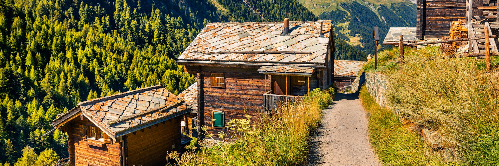 Sunny summer morning in Zermatt village with Matterhorn (Monte Cervino, Mont Cervin) peak on backgroud. Beautiful outdoor scene in Swiss Alps, Valais canton, Switzerland, Europe.