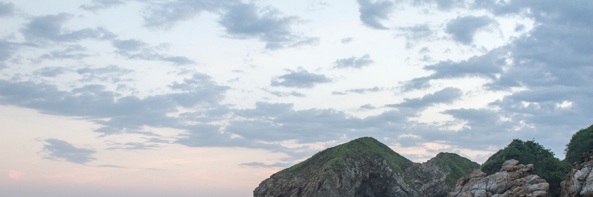 Sunset at the touristic Zipolite beach in Oaxaca, Mexico. Rocky beach with no people.; Shutterstock ID 2275510841; your: Sloane Tucker; gl: 65050; netsuite: Online Editorial; full: POI
2275510841