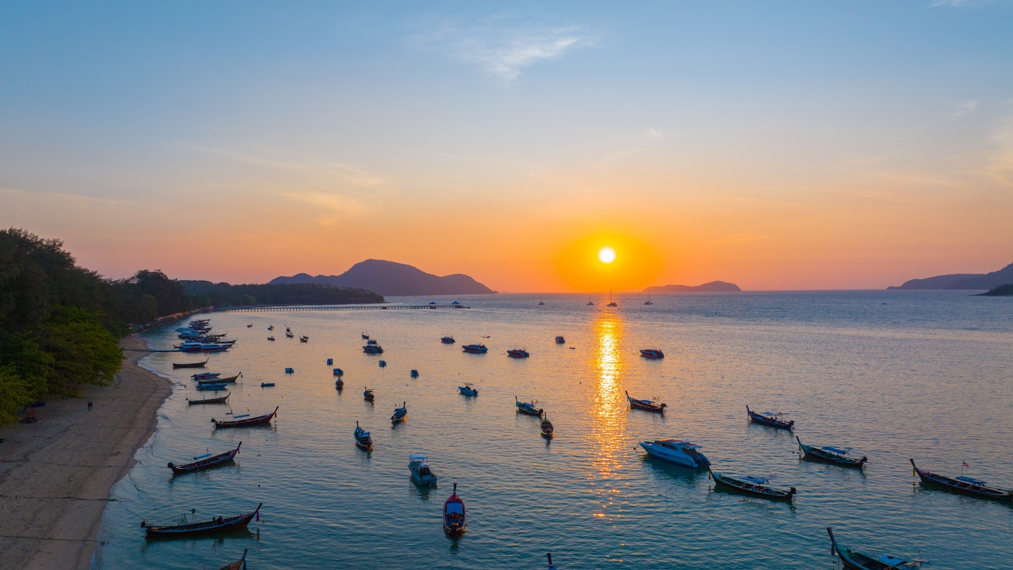 Morning sunrise on the beach with many fishing boats and tourist boats floating on the shore in Rawai Beach, Phuket, Thailand; Shutterstock ID 2457706921; purchase_order:65050; job:Online Editorial; client:Phuket First Time; other:Tasmin Waby
2457706921