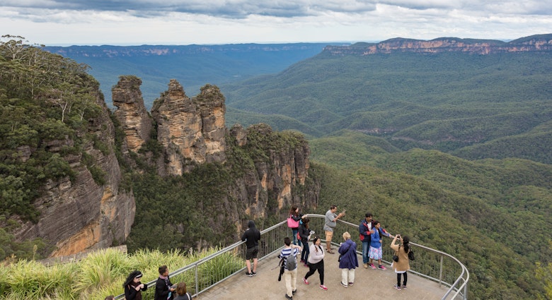 Blue Mountains, Australia - May 1, 2016: People at observation deck at Echo point lookout with view of famous Three Sisters mountains and Blue Mountains eucalyptus forest; Shutterstock ID 646238473; purchase_order: 65050 - Digital Destinations and Articles; job: Lonely Planet Online Editorial; client: Day trips from Sydney; other: Brian Healy
646238473
australia, australian, beautiful, blue mountains, destination, echo point, eucalyptus, famous, forest, katoomba, landmark, landscape, lookout, mountain, nature, new south wales, nsw, observation deck, panorama, panoramic, people, place, popular, real people, three sisters, tourism, tourist, travel, travel destination, view
People at observation deck at Echo point lookout with view of famous Three Sisters mountains and Blue Mountains eucalyptus forest