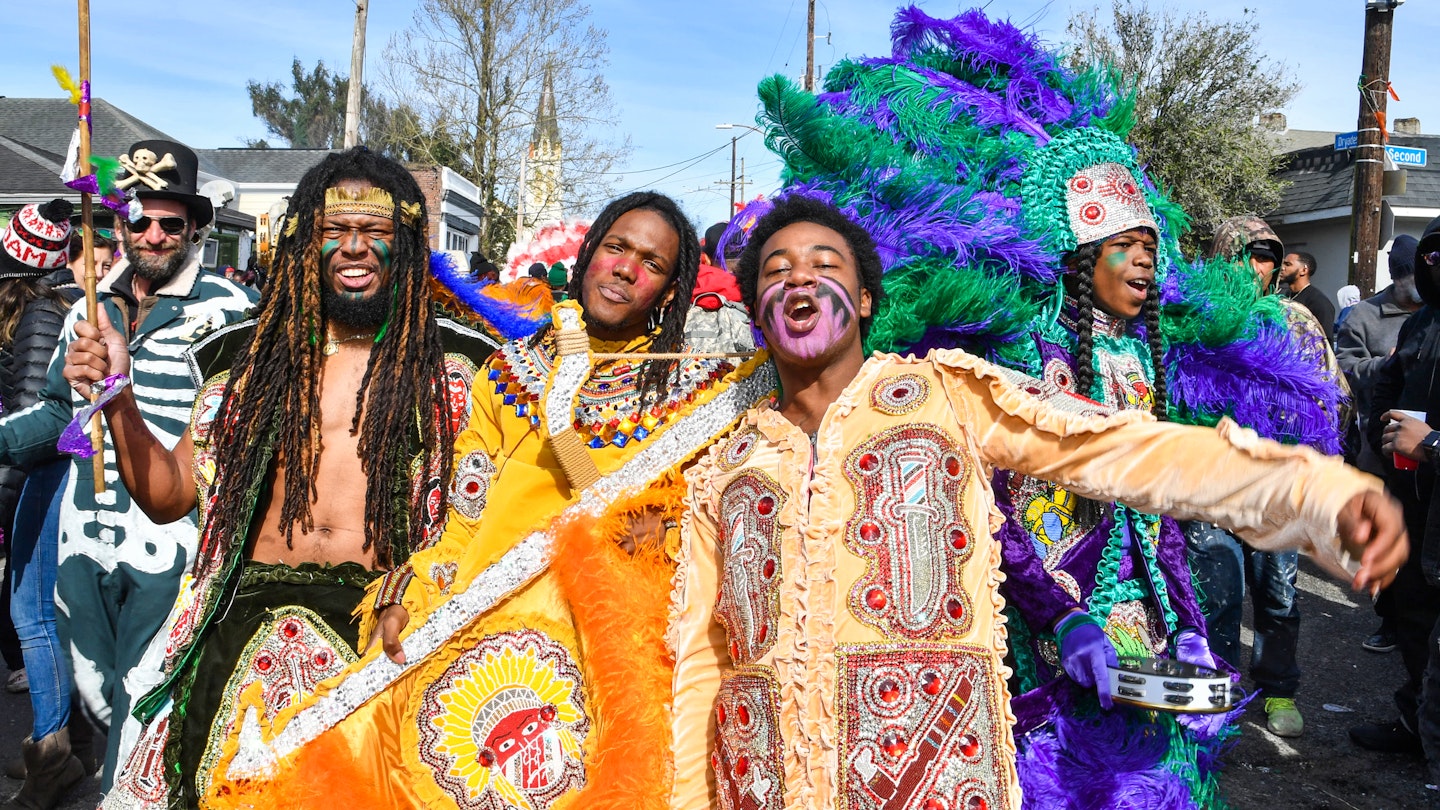 NEW ORLEANS, LOUISIANA - MARCH 05: (L-R) Lawrence Boudreaux, Marwan Pleasant, Jwan Boudreaux, and Nigel Pleasant of the Golden Eagles Mardi Gras Indians face off with another tribe on March 5, 2019 in New Orleans, Louisiana. (Photo by Erika Goldring/Getty Images)