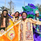 NEW ORLEANS, LOUISIANA - MARCH 05: (L-R) Lawrence Boudreaux, Marwan Pleasant, Jwan Boudreaux, and Nigel Pleasant of the Golden Eagles Mardi Gras Indians face off with another tribe on March 5, 2019 in New Orleans, Louisiana. (Photo by Erika Goldring/Getty Images)