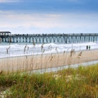 Myrtle Beach State Park and its pier, on the Grand Strand.
604557185
Architecture, Pier, Grand Strand, State Park, Beach
A couple walk past the pier at Myrtle Beach State Park.