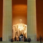 Visitors at the Lincoln Memorial in Washington, DC at night.